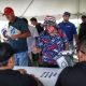 A fan gives Tony Stewart the thumbs up in the autograph signing tent