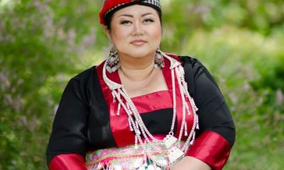 annie vang in red traditional hmong robes