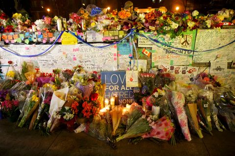 flowers, cards, and words of sympathy adorn a makeshift memorial in toronto the day after alek minassian drove a van into a group of pedestrians, killing 10 and injuring 16