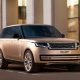 Gold 2022 Range Rover SUV parked on a rendering of a city street