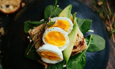 Hard boiled eggs on toast with spinach