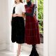 two models wear dresses from hill house home 2021 holiday collection in front of a white window
