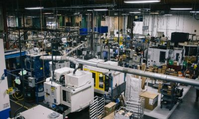 Interior wide shot of the Benchmade factory with rows of machines