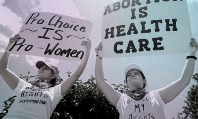 two women hold sings that read pro choice is pro women and abortion is health care