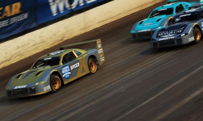 Cars racing on track