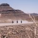 Three motorcycles riding through Africa's Namib desert