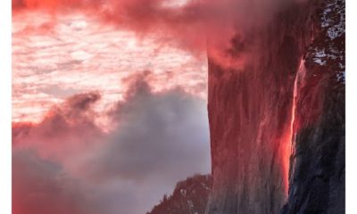 Sunset on Yosemite's El Capitan cliff with Horsetail Falls glowing red from reflected sunlight