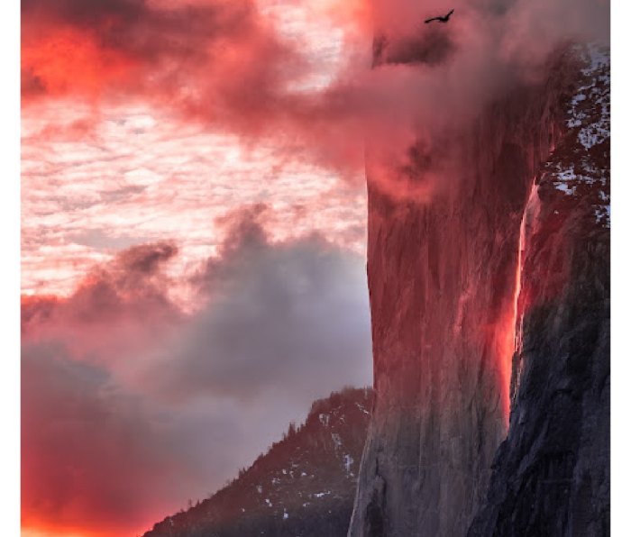 Sunset on Yosemite's El Capitan cliff with Horsetail Falls glowing red from reflected sunlight