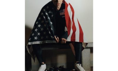 Team USA speed skater Conor McDermott-Mostowy draped in a US flag