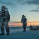 Nikolaj Coster-Waldau and co-star Joe Cole stand next their sled in the Arctic during a scene in