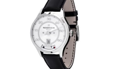 Reservoir kanister watch with a white dail and a black leather strap
