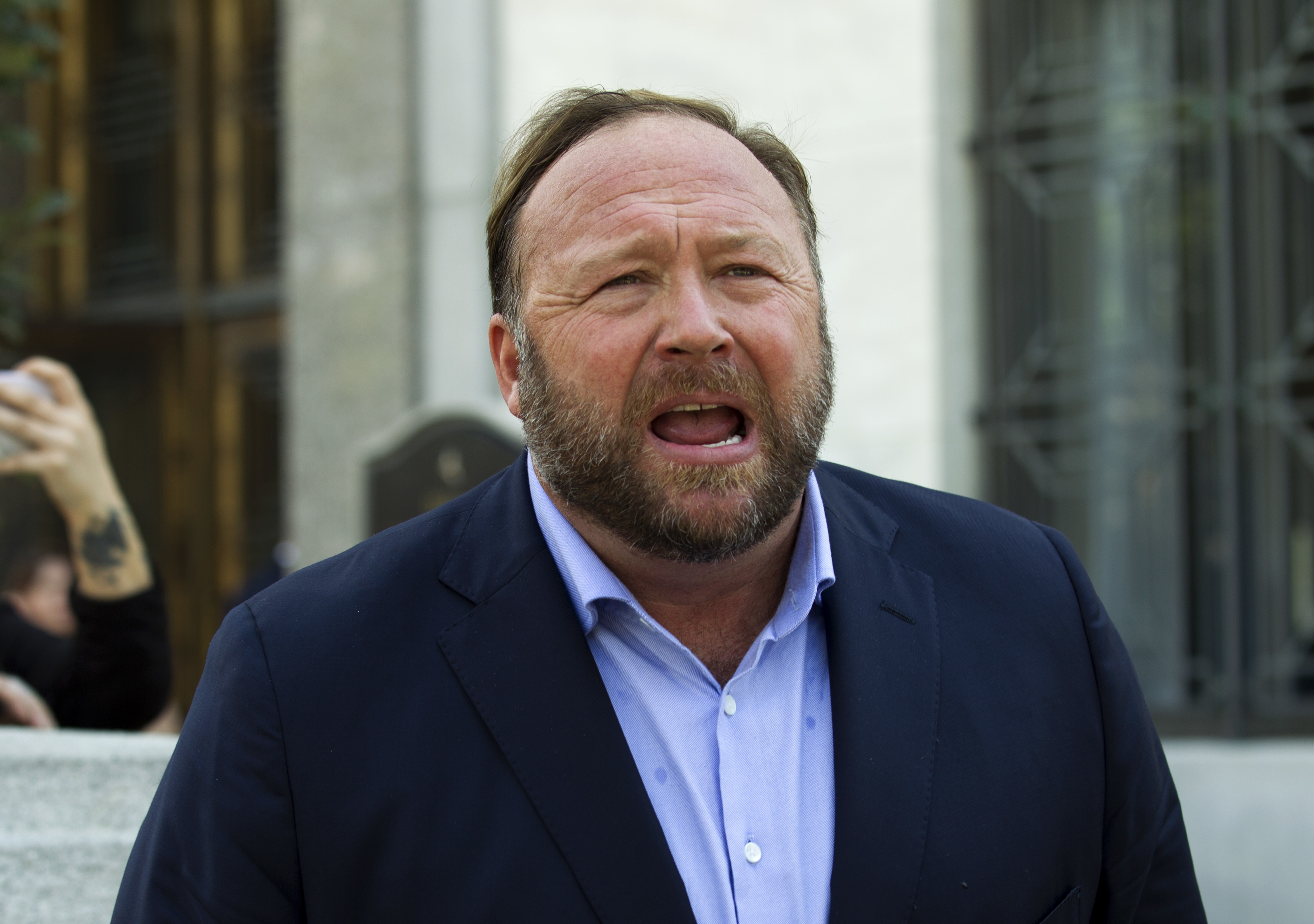 What Infowars' bankruptcy filing means for Sandy Hook families who sued Alex Jones for calling school massacre a hoax