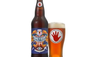 Left Hand Brewing Homefront IPA bottle next to glass of beer in front of American flag