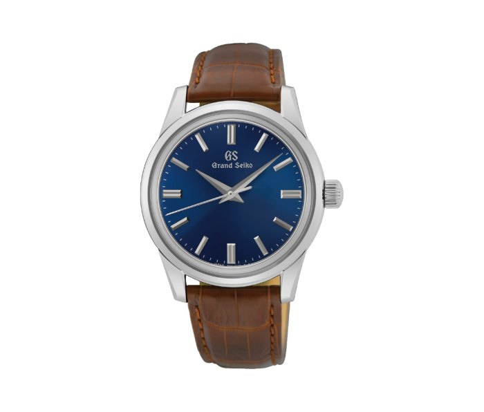 Grand Seiko SBGW279 watch with a brown leather band on a white background