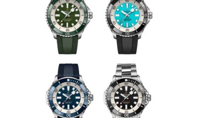 Four Breitling Superocean watches on a white background