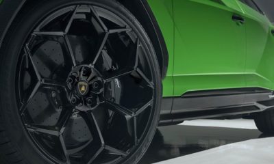 Closeup of green sports car's tires