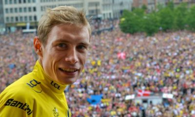 2022 Tour de France champion, Denmark's Jonas Vingegaard, wearing his yellow jersey with crowd in the background