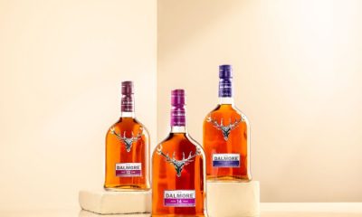 Trio of whiskey bottles with steer on front