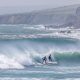 Two surfers on a wave on Ireland's west coast.
