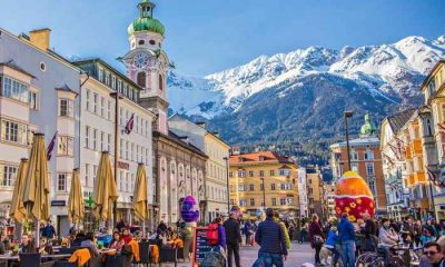 Innsbruck town center with lots of people and street cafes.