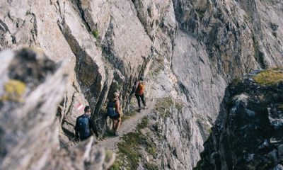 Hikers walking along via ferrata cliff on Austria's Eagle Way